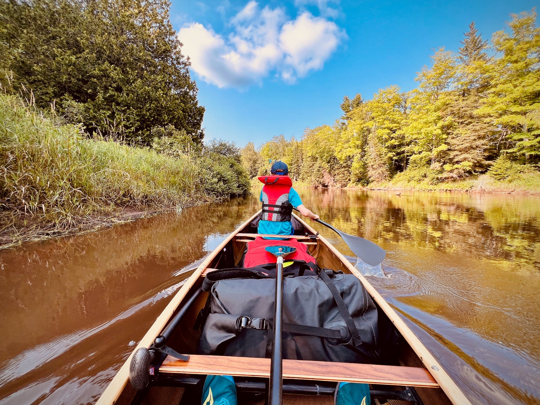 Canoe on the Manistique River outfitted with RedLeaf paddling accessories